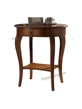 אמריקאי מעץ מלא בצד כמה פינות כמה אליפסה, שולחן, טלפון, שולחן הספה לצד שולחן קפה שולחן קפה קטן שולחן עגול